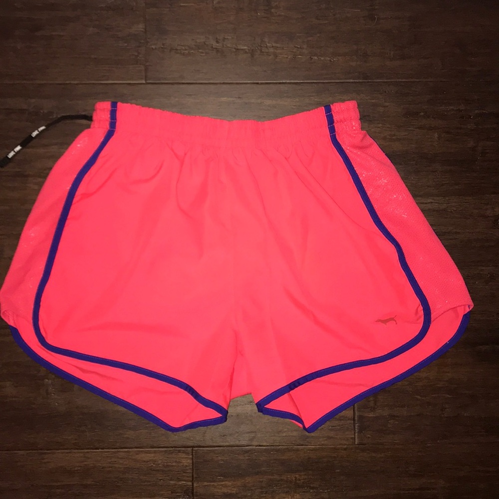 A pair of extra small pink brand shorts.